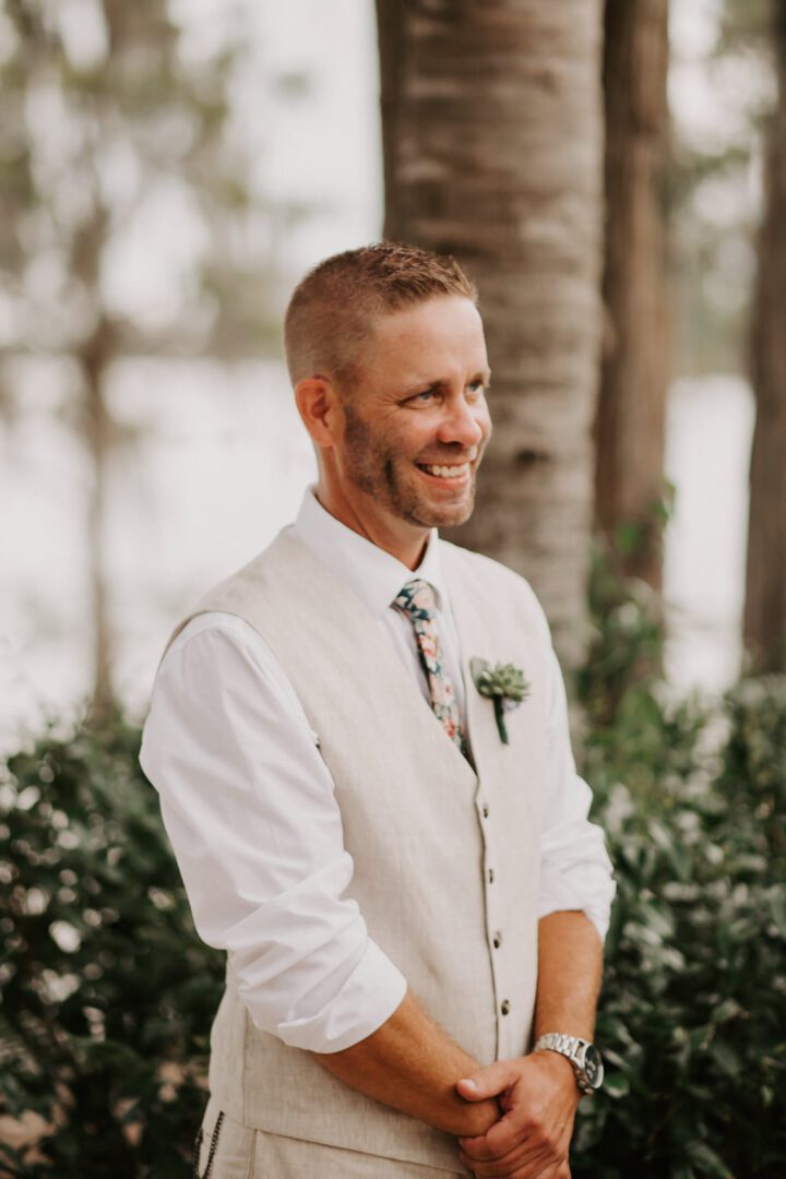 A Groom Wearing a Cream Color Vest