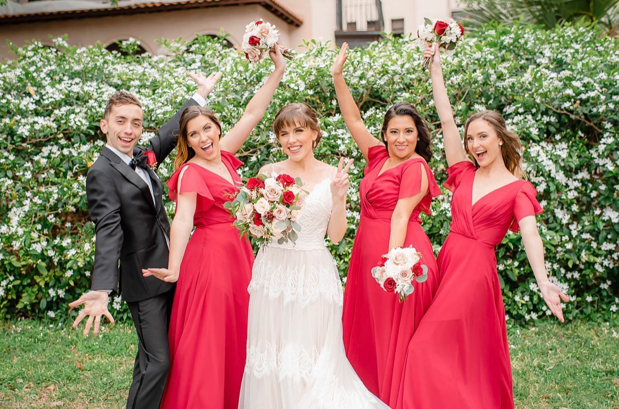 A Bride With Bridesmaids in Red Color Dresses
