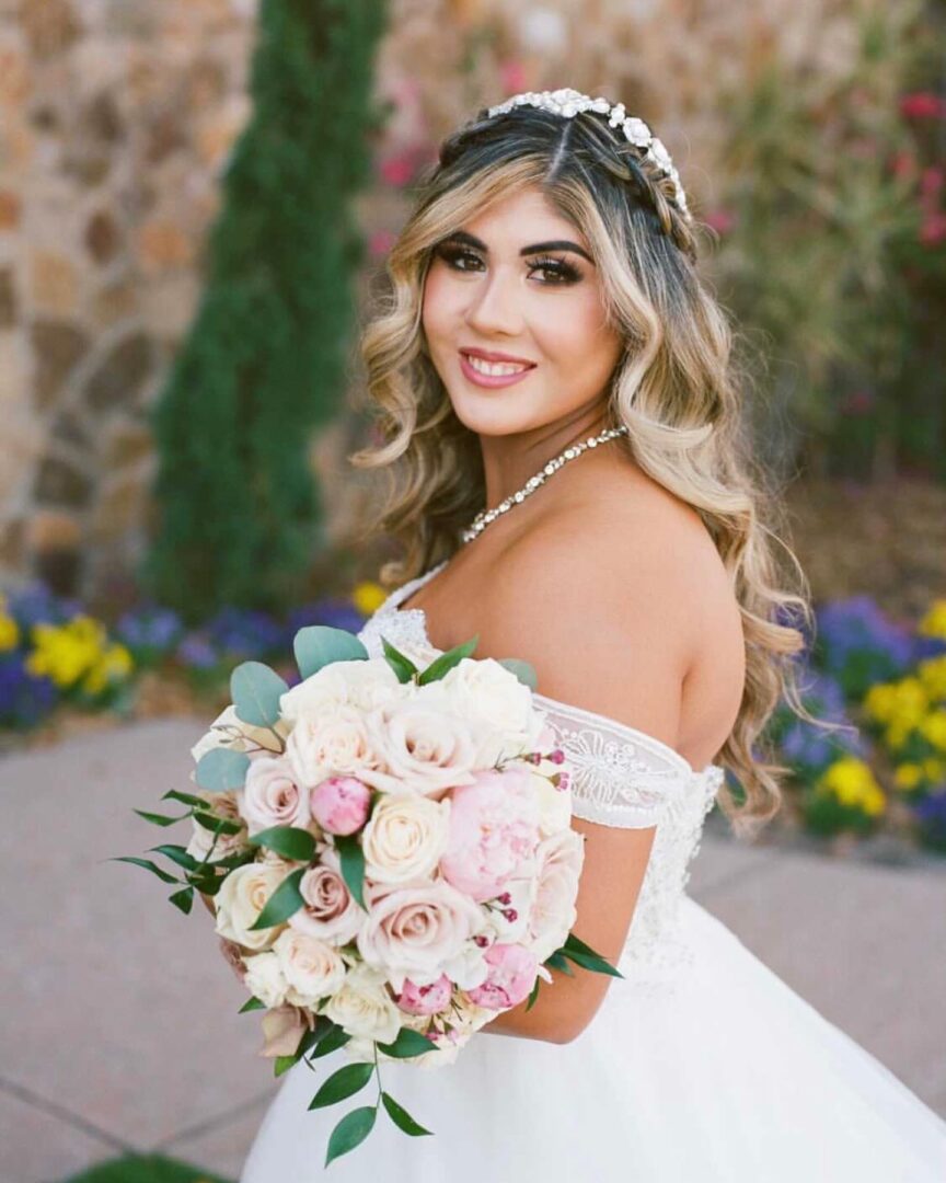 A Bride in a White Dress Holding a Rose Bouquet