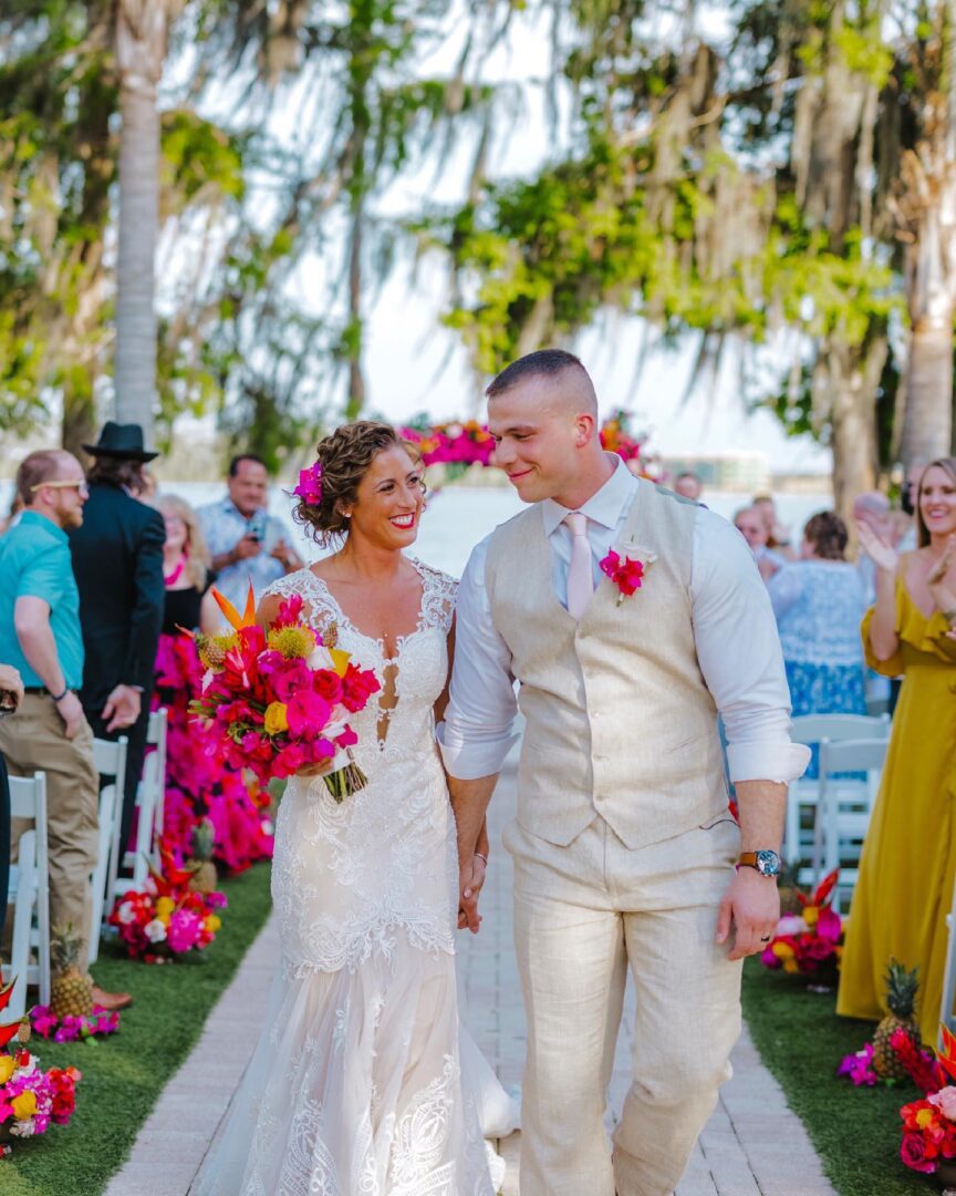 A couple walking down the aisle at their wedding.