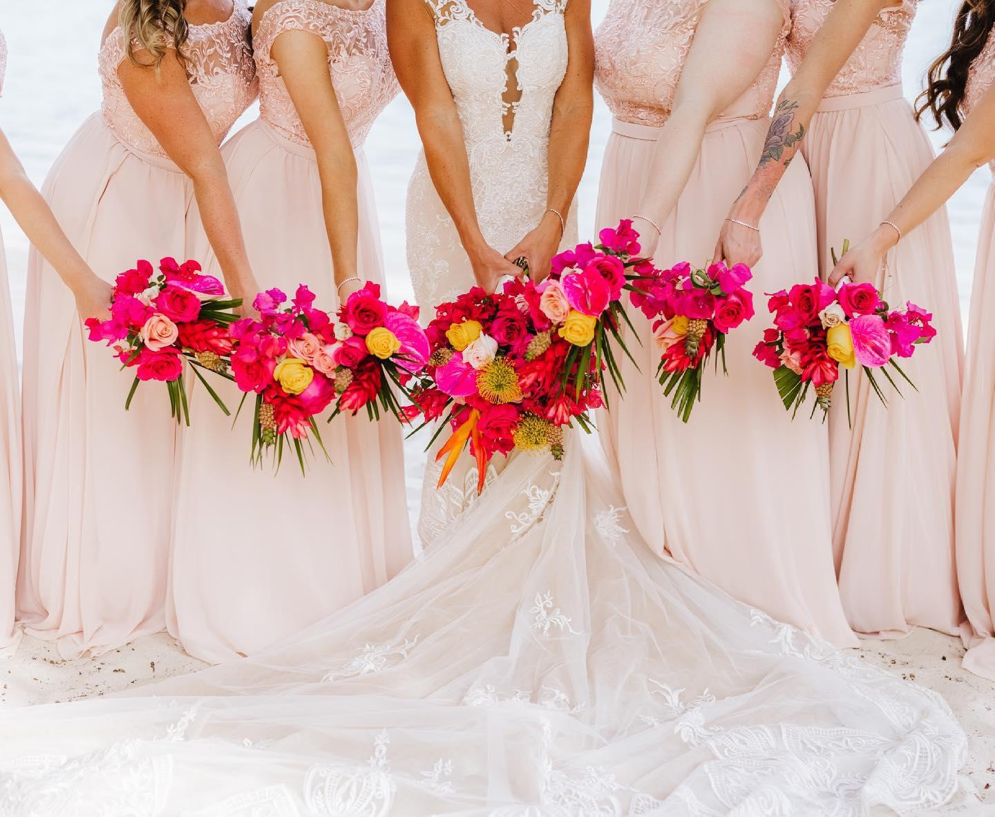 Colorful Flower Bunches in the Bride Party Hands