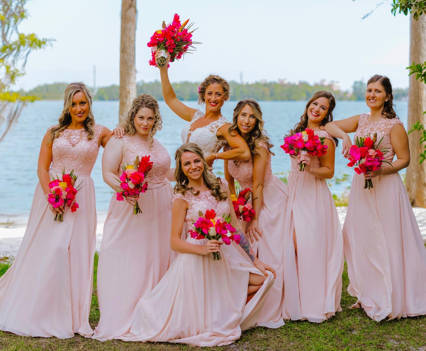 A Bride With Bridesmaids in Pink With Colorful Flowers
