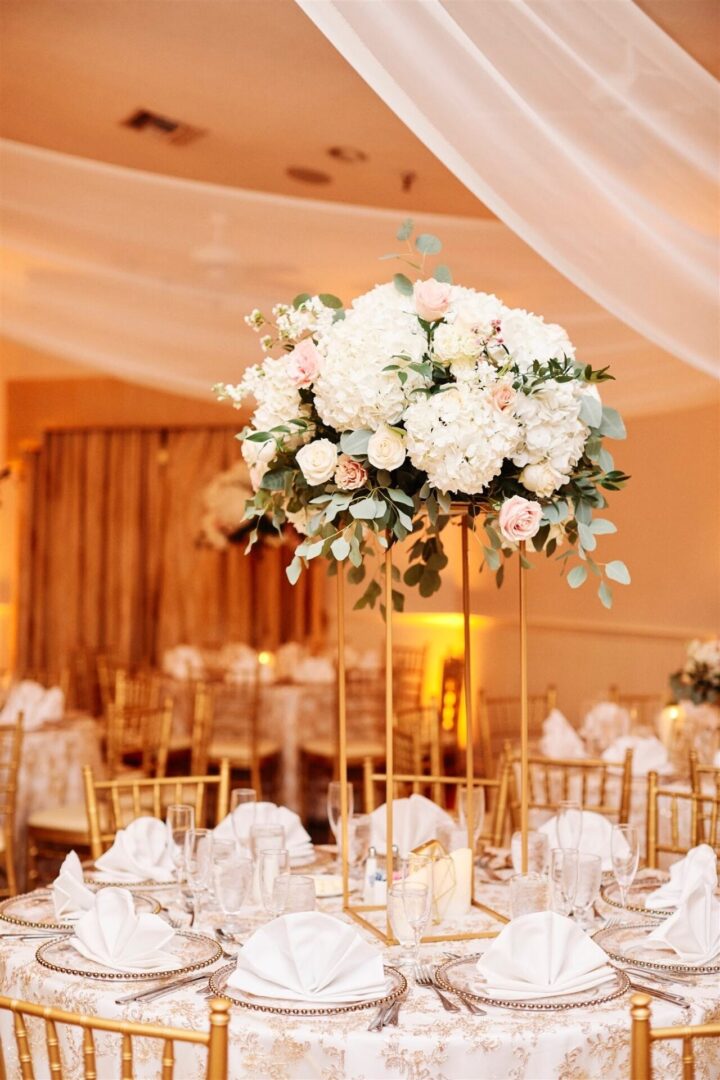 A table with chairs and tables in the background.