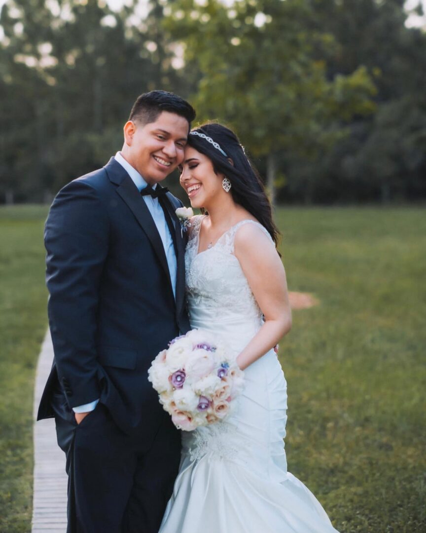 A Bride and Groom Smiling and Holding Each Other