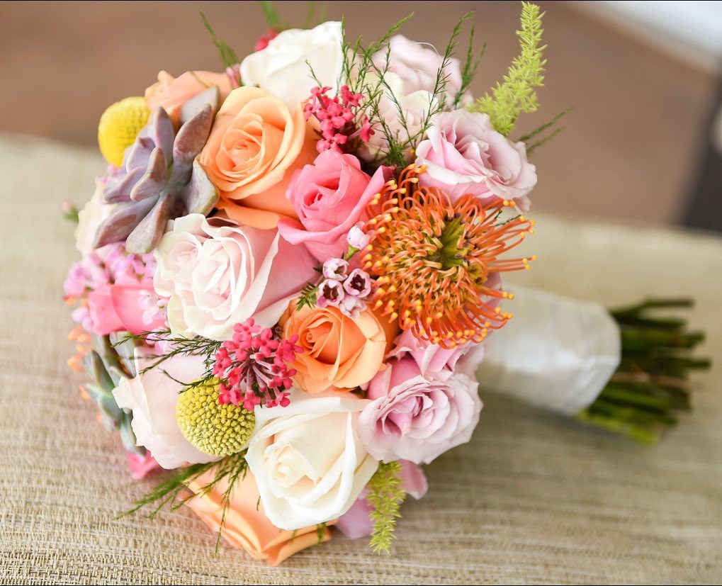 A Multi Color Flower Bunch on a Table