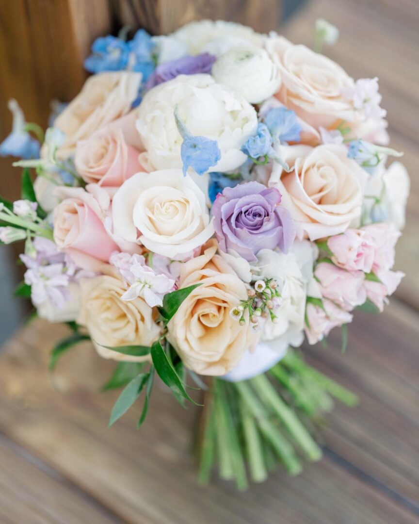 A bouquet of flowers is sitting on the ground.