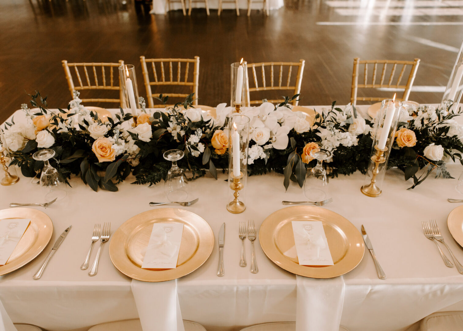Cream Color Plates Placed on a White Cloth Table