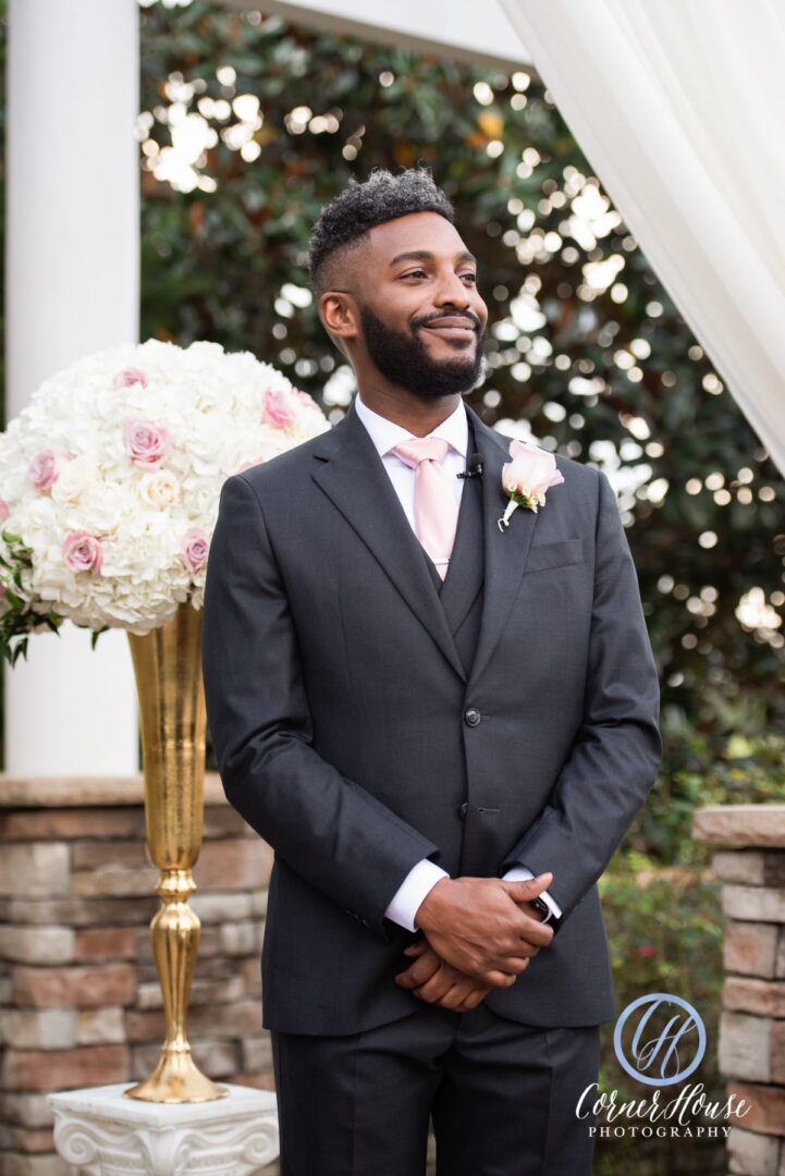 A Groom Standing in a Three Piece Suit