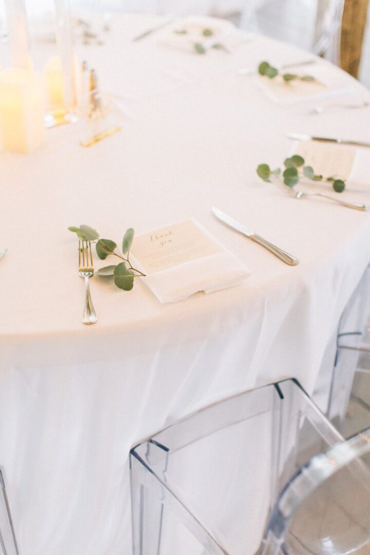A White Color Table With Leaves as Decor