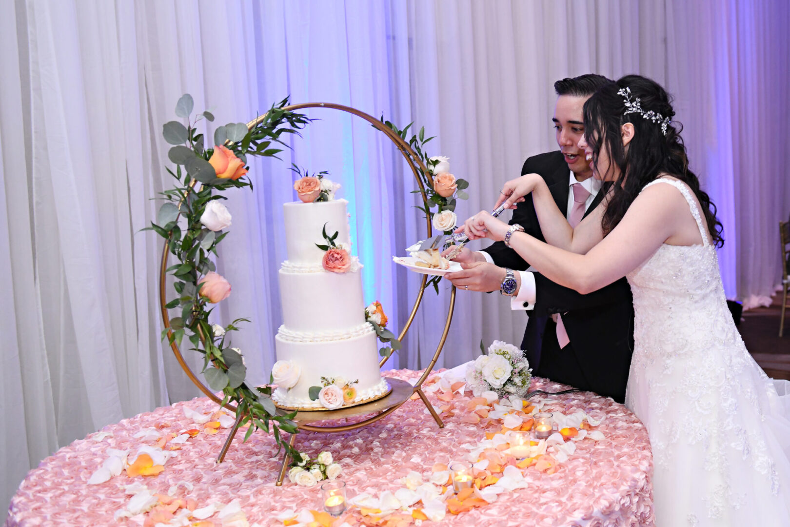 A Newly Weeded Couple Cutting a Cake