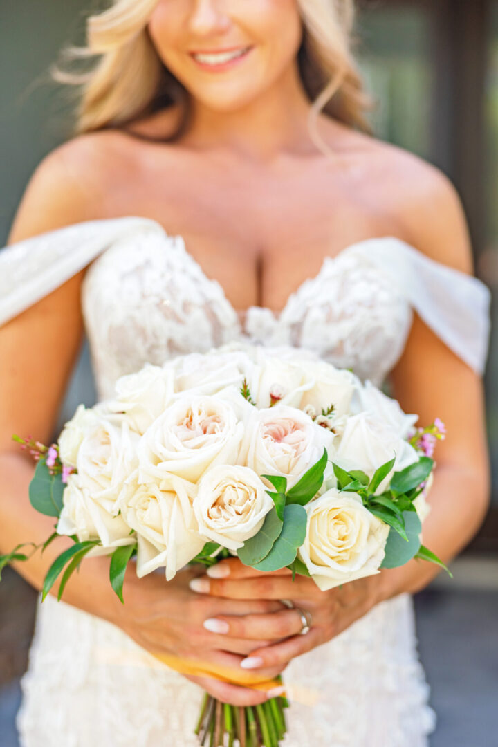 A Woman With a Bunch of White Roses