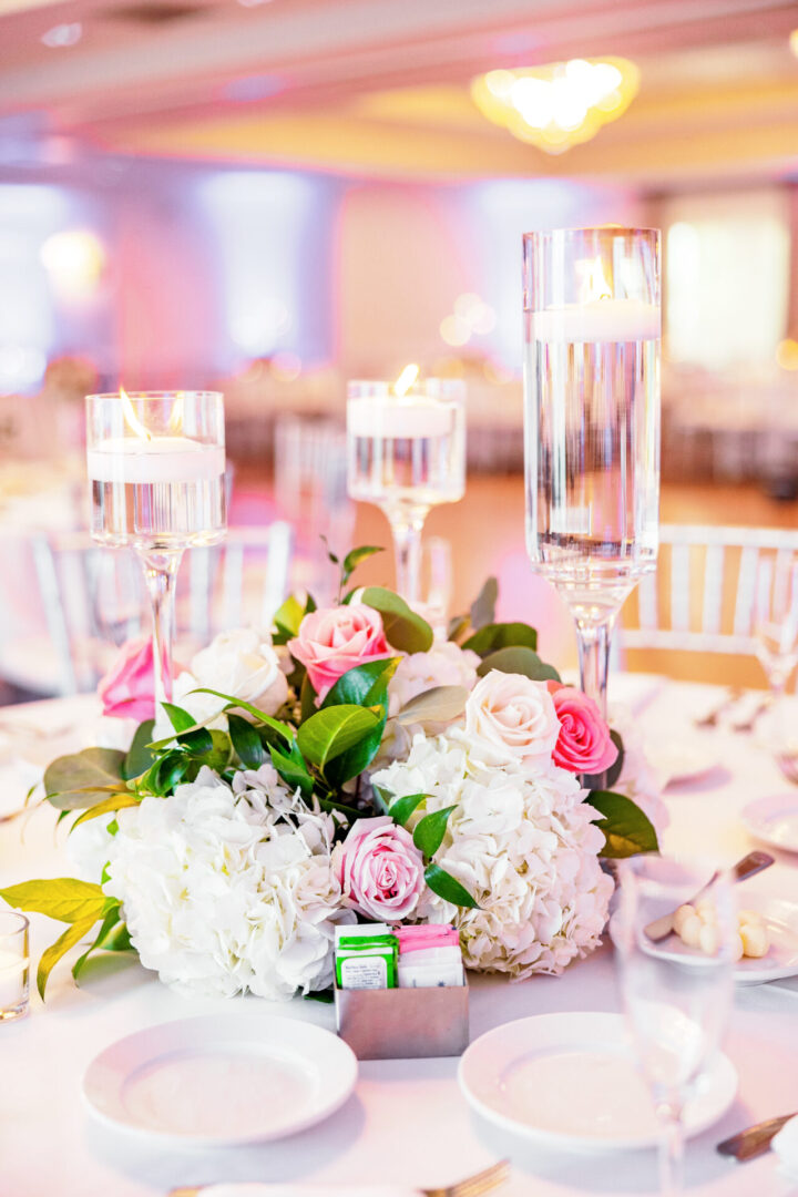 A Table With Pink and White Flower Arrangement