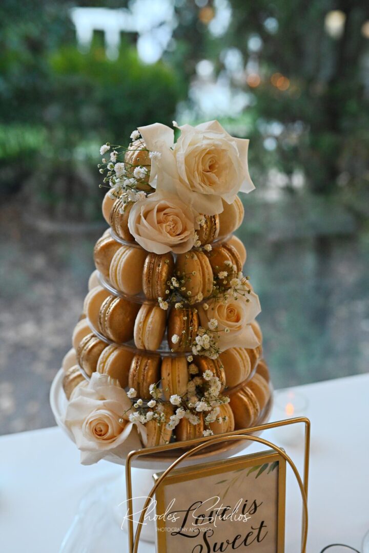 Macrons Placed on a Cookie Stand With Flowers