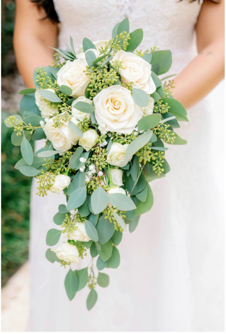 A bride holding her bouquet of flowers