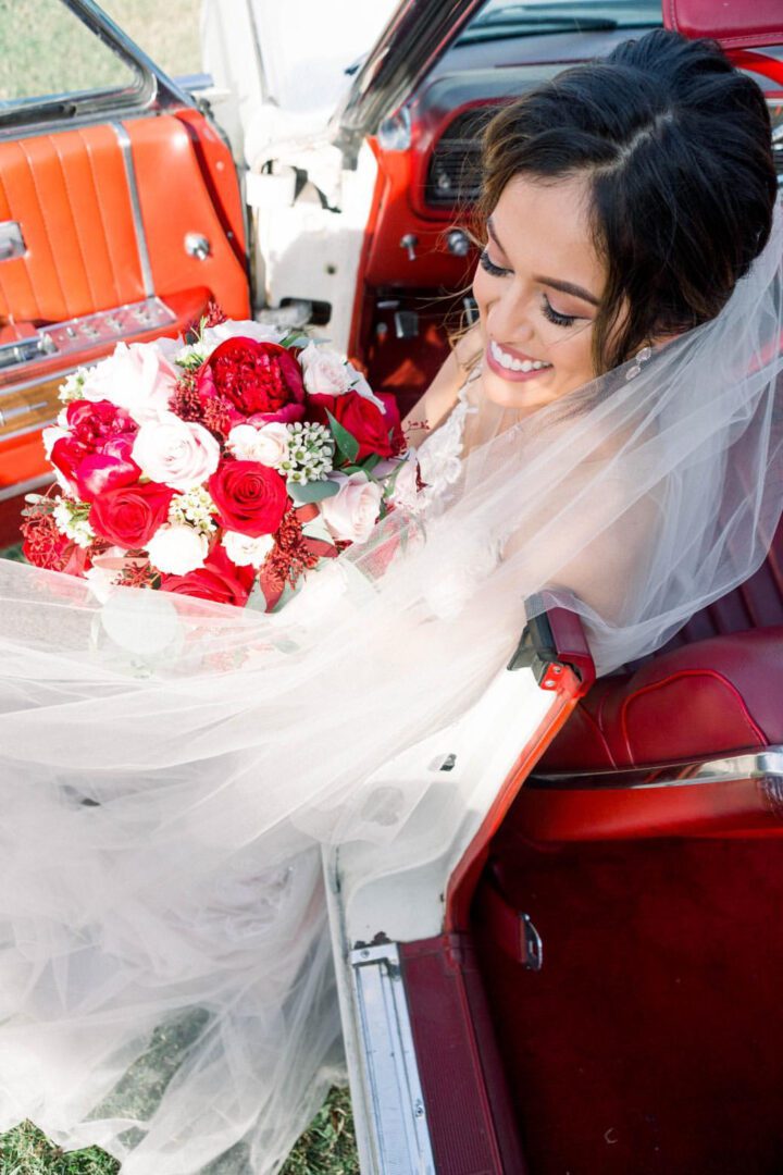 A Woman With a Red and White Rose Bouquet