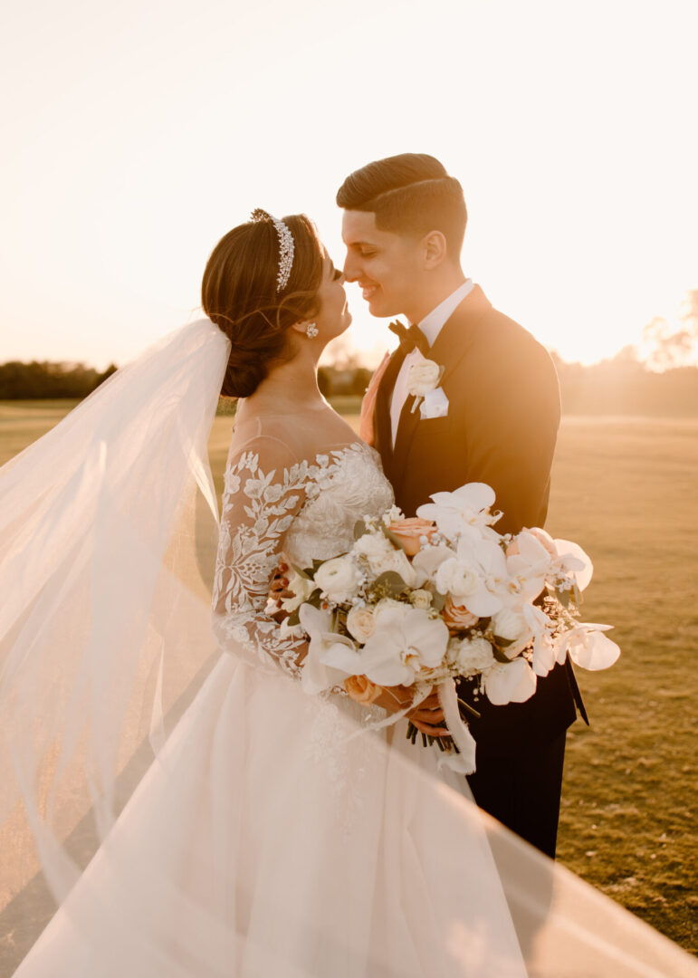 A Bride and Groom Kissing Each Other in Sunset
