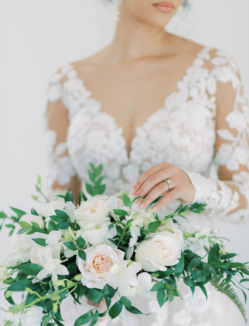 A Bride Holding White Roses in Hand