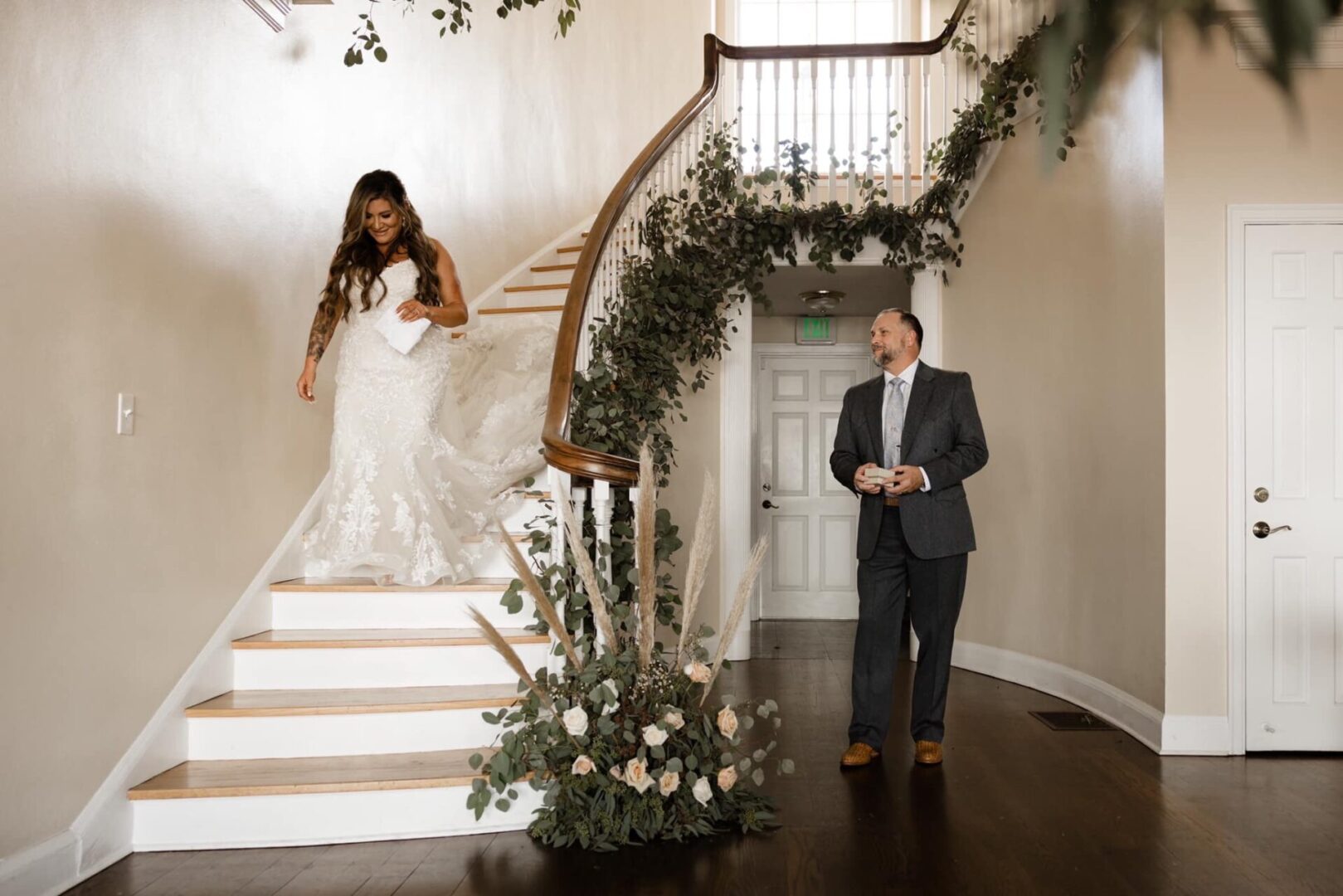 A Bride Walking Down the Stairs in a Gown
