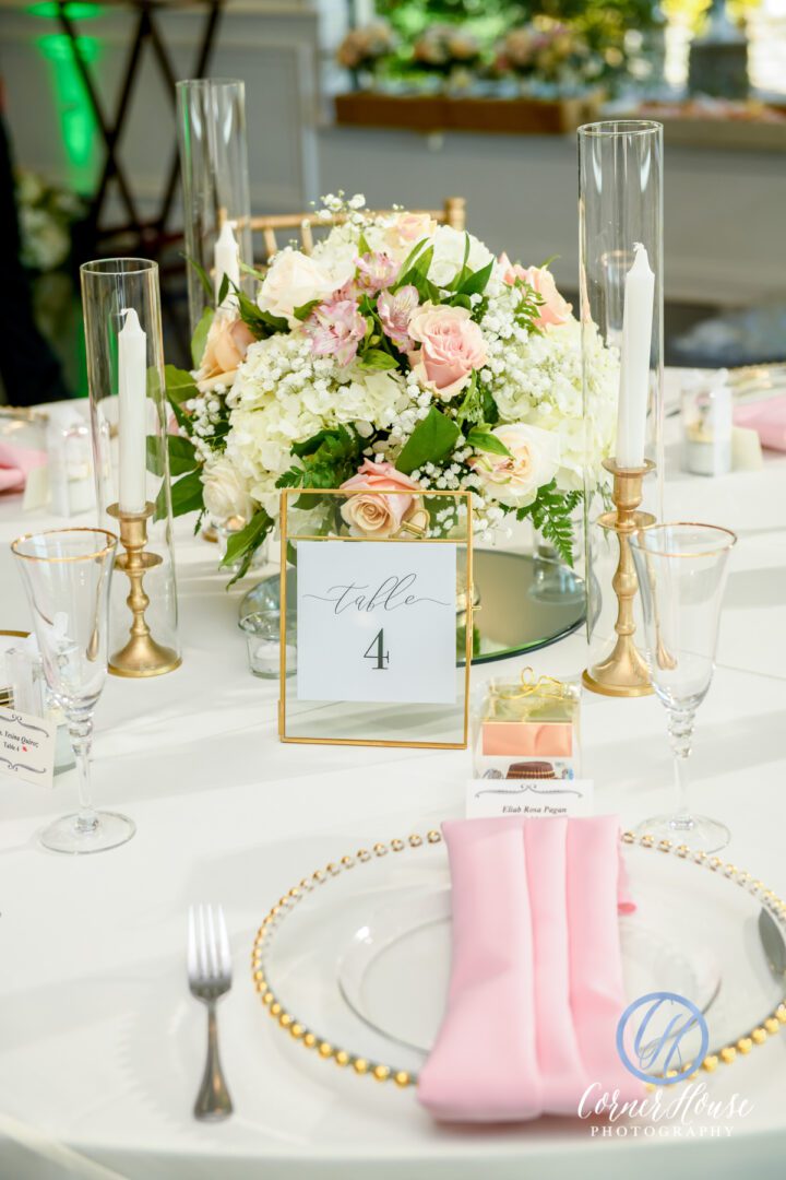 A White Color Plate With Pink Color Napkins